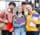A group of students with backpacks smiling for the photo.