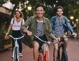 group of young adults riding bikes