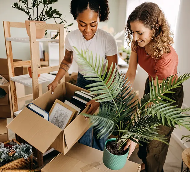 Young women unpacking